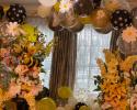 Black and yellow balloons with different size bee mylar balloons for our Bee inspired balloon arch. We also had large floral centerpieces