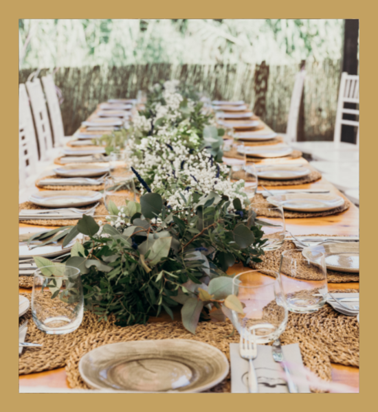 elegant table with greenery and placemats 