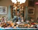 Mermaids, coral and sea shells decorate the buffet table. A few other decorations used for the under the sea themed birthday party were octopuses hung from the ceiling, star fish garlands, and a fish bowl as the centerpiece.   
