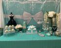 A Tiffany & Co. inspired sweet 16 birthday party! The Tiffany Blue dessert table was decorated with the classic Tiffany box cake, the Tiffany Blue photo backdrop with white bow, diamonds and pearls