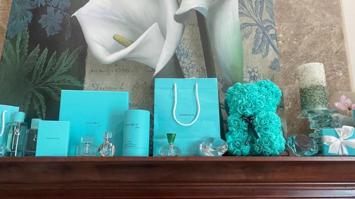 Perfume bottles, Tiffany & Co. bags and boxes were used to decorate the clients mantle 
